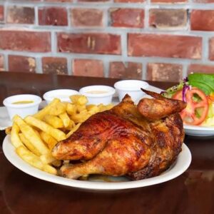 1/2 pollo + chaufa + gaseosa / calebs